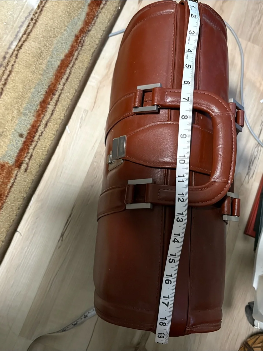 Litagator leather briefcase with security features and sturdy handles.